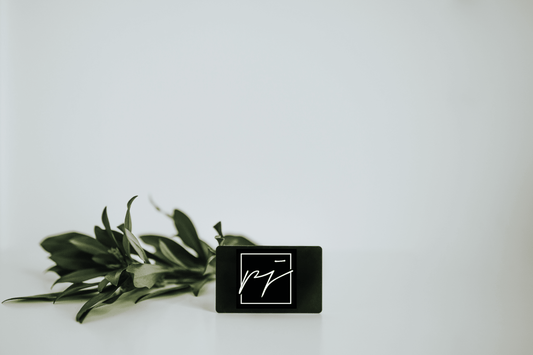 Black Gift Card with logo on a white background with greenery- lifewithPandJ