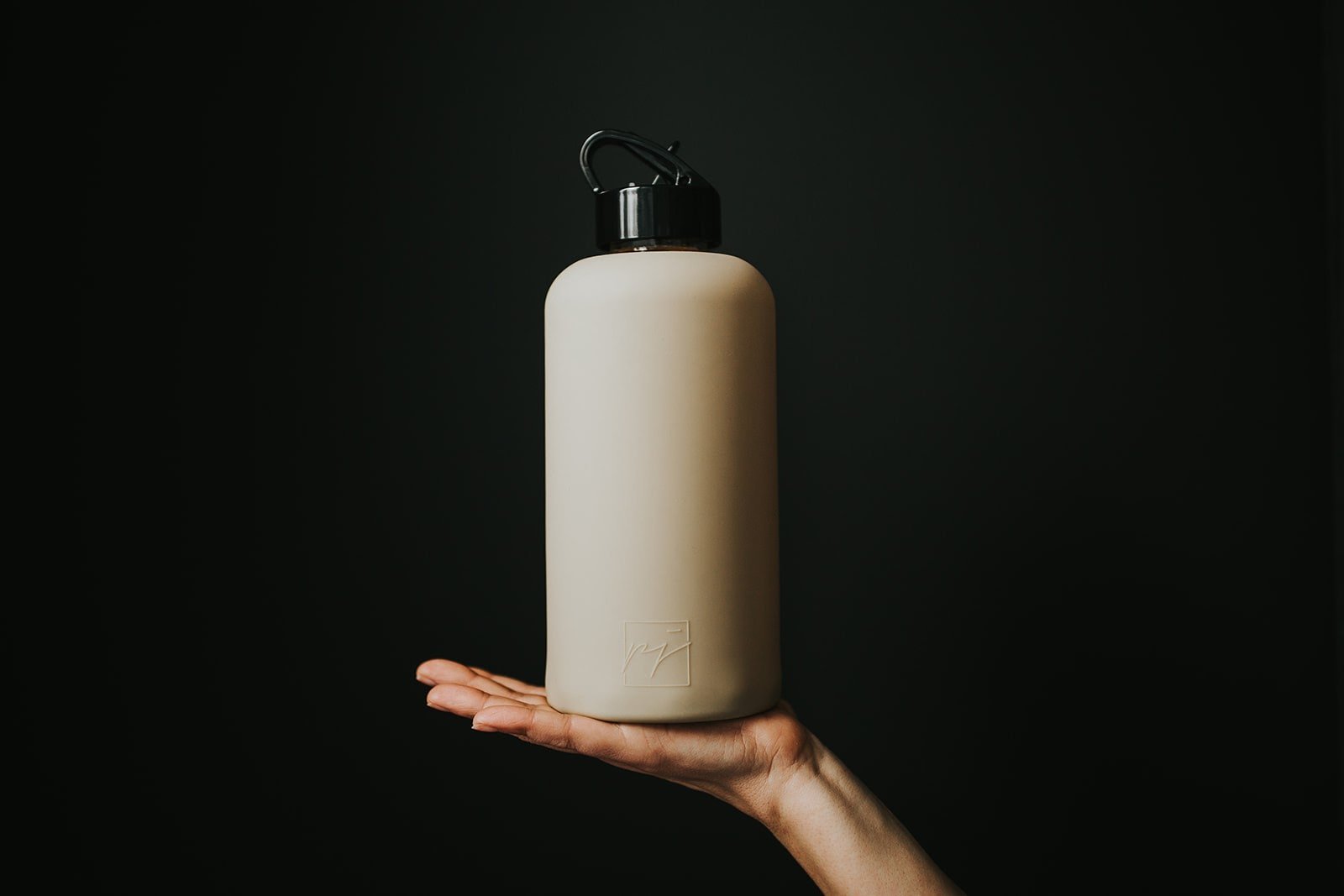 One litre glass water bottle with nude, sand protective silicone sleeve and high gloss black folding straw lid - lifewithPandJ
