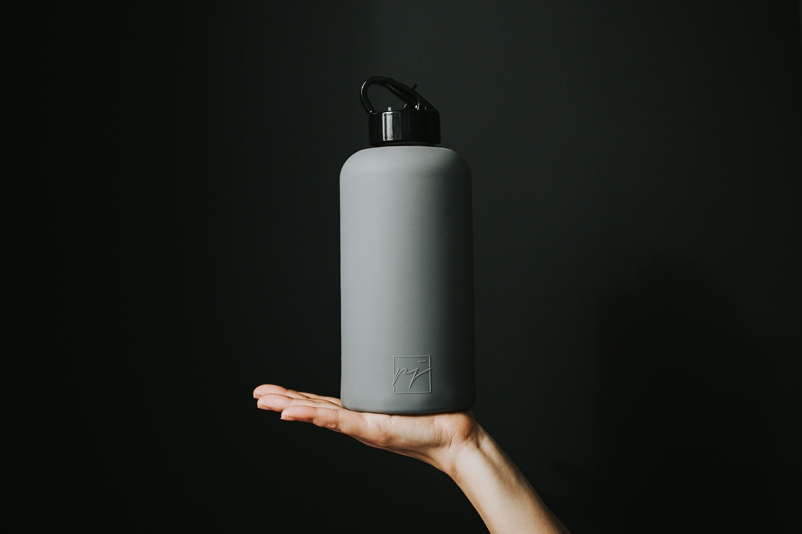 One litre glass water bottle with grey protective silicone sleeve and high gloss black folding straw lid - lifewithPandJ